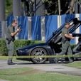  Une BMW est garée près du vendeur de moto où le rappeur XXXTentacion a été assassiné le 18 juin 2018 à Miami.  
  