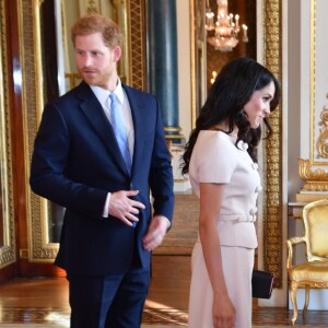 Le prince Harry, duc de Sussex, et Meghan Markle, duchesse de Sussex, au palais de Buckingham à Londres le 26 juin 2018 pour la réception des Queen's Young Leaders Awards.