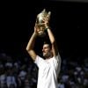 Novak Djokovic with the trophy after winning the Gentlemen's Singles Final against Kevin Anderson on day thirteen of the Wimbledon Championships at the All England Lawn Tennis and Croquet Club, Wimbledon. PRESS ASSOCIATION Photo. Picture date: Sunday July 15, 2018. See PA story TENNIS Wimbledon. Photo credit should read: Tim Ireland/PA Wire. RESTRICTIONS: Editorial use only. No commercial use without prior written consent of the AELTC. Still image use only - no moving images to emulate broadcast. No superimposing or removal of sponsor/ad logos. Call +44 (0)1158 447447 for further information. ... Wimbledon 2018 - Day Thirteen - The All England Lawn Tennis and Croquet Club ... 15-07-2018 ... London ... UK ... Photo credit should read: Tim Ireland/PA Wire. Unique Reference No. 37586084 ...15/07/2018 - 