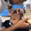 Tony Yoka publie une vidéo de son fils Ali, 1 an, chez le coiffeur. Instagram, le 25 juillet 2018.
