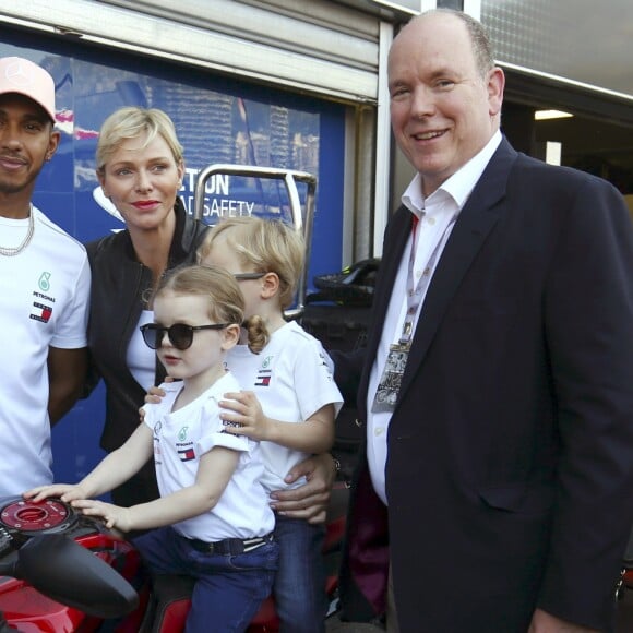 Exclusif - La princesse Gabriella et le prince Jacques de Monaco sur une moto sous les yeux de Lewis Hamilton et de leurs parents le prince Albert II et la princesse Charlene de Monaco lors de leur visite du paddock du Grand Prix de Formule 1 de Monaco le 25 mai 2018