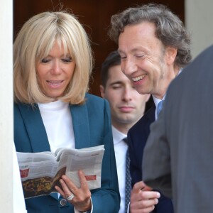 Stéphane Bern, chargé de mission pour le patrimoine et la Première Dame Brigitte Macron (Trogneux) - Le président de la République française et le chargé de mission pour le patrimoine français lancent le Loto "Mission Patrimoine" au palais de l'Elysée à Paris, France, le 31 mai 2018. L'objectif est de susciter une grande mobilisation populaire autour d'une loterie et d'un jeu de grattage qui seront lancés à la rentrée pour financer la rénovation de 270 projets sélectionnés (monuments historiques en péril aux quatre coins de toute la France) par la mission menée par S.Bern. © Giancarlo Gorassini/Bestimage