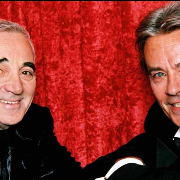 ARCHIVES - Charles Aznavour et Alain Delon en décembre 1997.