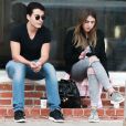 Exclusif - Manolo Vergara (le fils de Sofia Vergara) fait une pause cigarette avec une amie dans les rues de Melrose place à West Hollywood, le 11 avril 2016