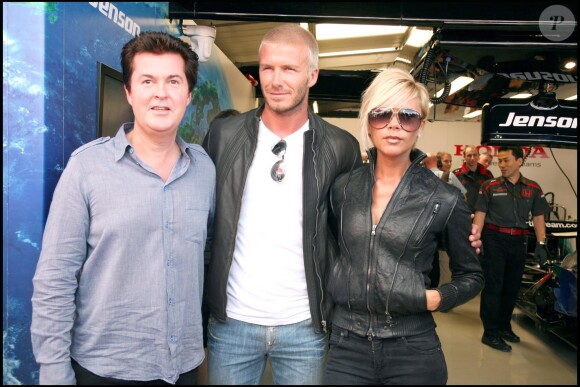 David et Victoria Beckham avec Simon Fuller au Grand Prix de Formule 1 de Grande-Bretagne en juillet 2007