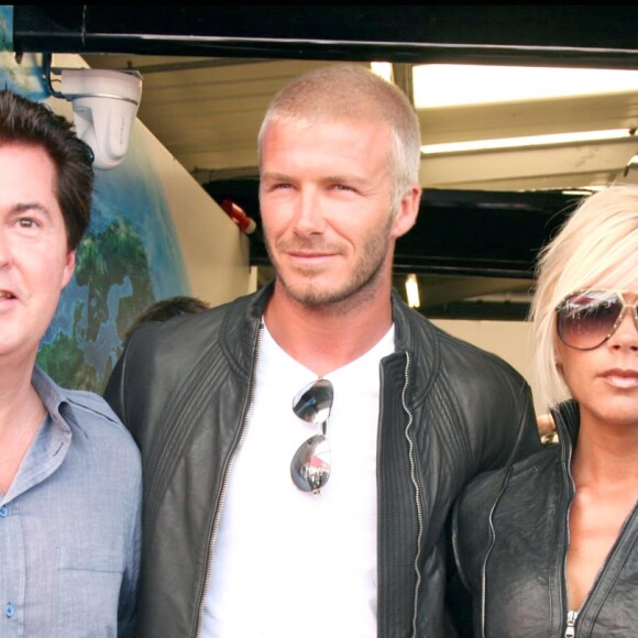 David et Victoria Beckham avec Simon Fuller au Grand Prix de Formule 1 de Grande-Bretagne en juillet 2007