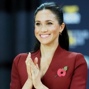 Le prince Harry, duc de Sussex, et Meghan Markle, duchesse de Sussex, enceinte, assistent à la finale de basketball en fauteuil roulant aux Invictus Games 2018 à Sydney, le 27 octobre 2018.