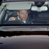 Le prince Harry et la duchesse Meghan de Sussex (Meghan Markle), enceinte et en robe Erdem, en voiture au palais de Buckingham à Londres le 19 décembre 2018 pour le traditionnel déjeuner de Noël anticipé organisé par la reine Elizabeth II.