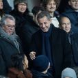 Nicolas Sarkozy, sous l'oeil de Jean-Luc Guizonne, dans les tribunes du Parc des Princes lors du match de Coupe du France "PSG - Strasbourg (2-0)" à Paris, le 23 janvier 2019.