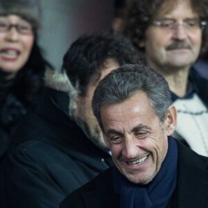 Nicolas Sarkozy, sous l'oeil de Jean-Luc Guizonne, dans les tribunes du Parc des Princes lors du match de Coupe du France "PSG - Strasbourg (2-0)" à Paris, le 23 janvier 2019.