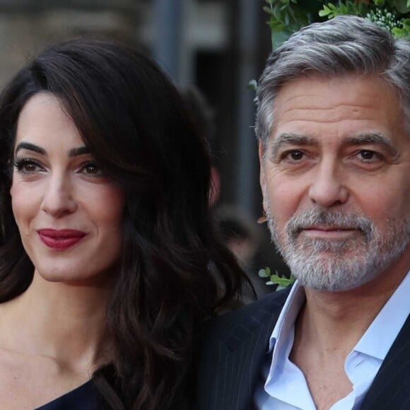 George Clooney et sa femme Amal arrivent à l'événement "Postcode Lottery Charity Gala" au McEwan hall à Edimbourg le 14 mars 2019.