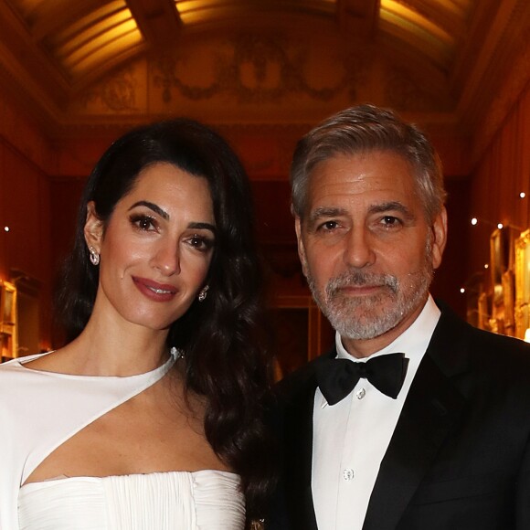George Clooney et sa femme Amal Clooney - Dîner "The Princes Trust" au Buckingham Palace à Londres, le 12 mars 2019.