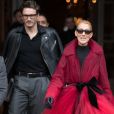 Céline Dion (qui porte une manteau en tulle rouge transparent) et son ami Pepe Munoz à la sortie de l'hotel Crillon à Paris se rendent au théâtre Mogador le 27 Janvier 2019.