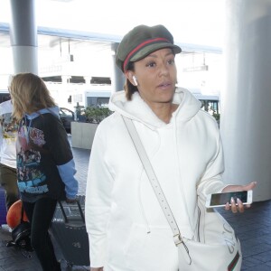 Mel B (Melanie Brown) arrive à l'aéroport de LAX à Los Angeles, le 20 mars 2019.