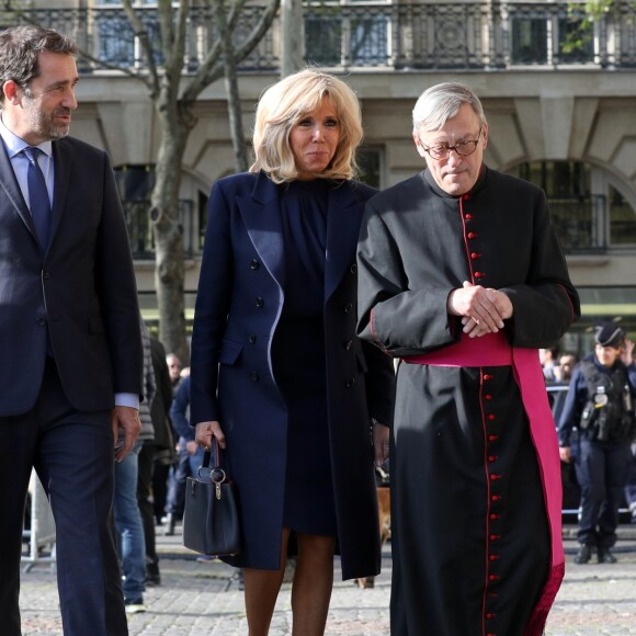 Christophe Castaner, ministre de l'intérieur, la première dame Brigitte Macron, Patrick Chauvet, recteur de Notre-Dame de Paris lors de la la messe chrismale dans l'église Saint-Sulpice à Paris au lieu de Notre-Dame le 17 avril 2019. © Stéphane Lemouton / Bestimage