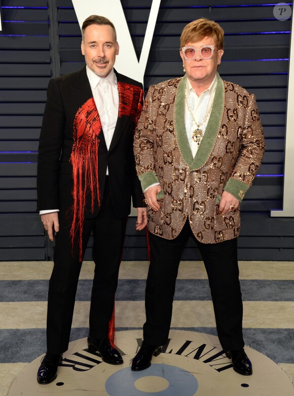 David Furnish et son mari Elton John - Soirée Vanity Fair Oscar Party à Los Angeles. Le 24 février 2019