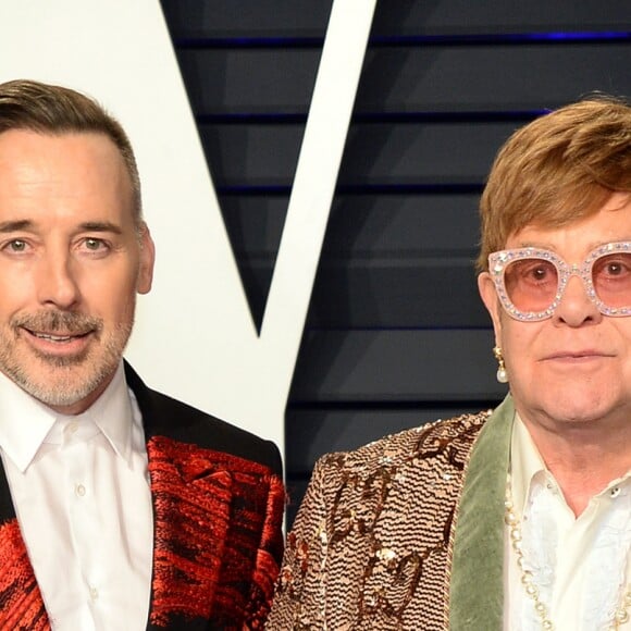 David Furnish et son mari Elton John - Soirée Vanity Fair Oscar Party à Los Angeles. Le 24 février 2019