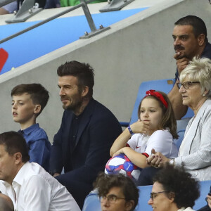 David Beckham avec sa fille Harper et sa mère Sandra Georgina West dans les tribunes lors du quart de finale de la Coupe du Monde Féminine de football opposant l'Angleterre à la Norvège au stade Océane au Havre, France, le 27 juin 2019. L'Angleterre a gagné 3-0. © Gwendoline Le Goff/Panoramic/Bestimage