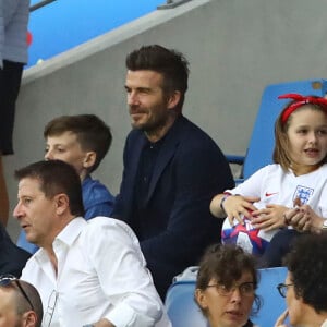 David Beckham avec sa fille Harper et sa mère Sandra Georgina West dans les tribunes lors du quart de finale de la Coupe du Monde Féminine de football opposant l'Angleterre à la Norvège au stade Océane au Havre, France, le 27 juin 2019. L'Angleterre a gagné 3-0. © Gwendoline Le Goff/Panoramic/Bestimage