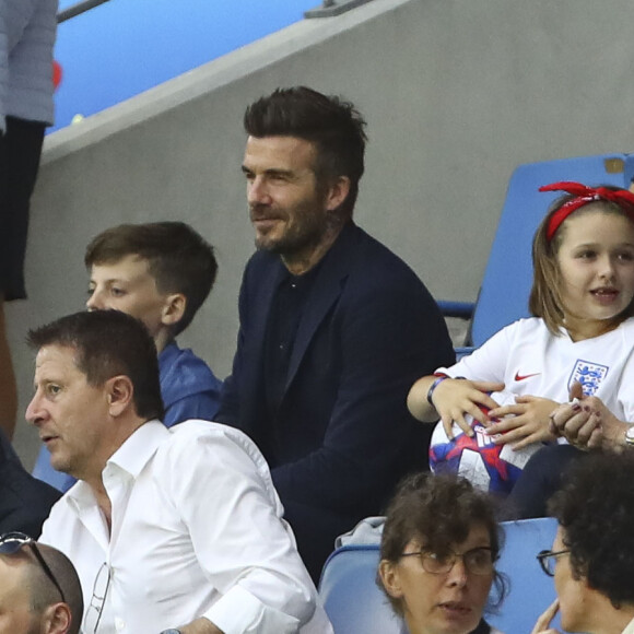 David Beckham avec sa fille Harper et sa mère Sandra Georgina West dans les tribunes lors du quart de finale de la Coupe du Monde Féminine de football opposant l'Angleterre à la Norvège au stade Océane au Havre, France, le 27 juin 2019. L'Angleterre a gagné 3-0. © Gwendoline Le Goff/Panoramic/Bestimage