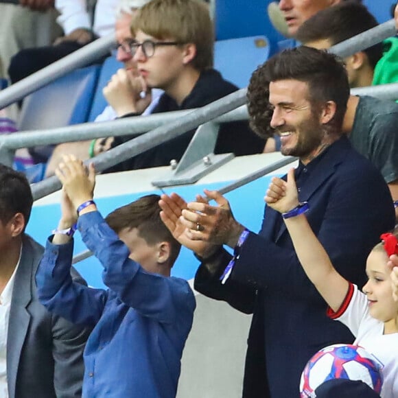 David Beckham avec sa fille Harper et sa mère Sandra Georgina West dans les tribunes lors du quart de finale de la Coupe du Monde Féminine de football opposant l'Angleterre à la Norvège au stade Océane au Havre, France, le 27 juin 2019. L'Angleterre a gagné 3-0. © Gwendoline Le Goff/Panoramic/Bestimage