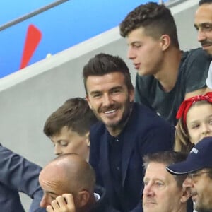 David Beckham avec sa fille Harper et sa mère Sandra Georgina West dans les tribunes lors du quart de finale de la Coupe du Monde Féminine de football opposant l'Angleterre à la Norvège au stade Océane au Havre, France, le 27 juin 2019. L'Angleterre a gagné 3-0. © Gwendoline Le Goff/Panoramic/Bestimage