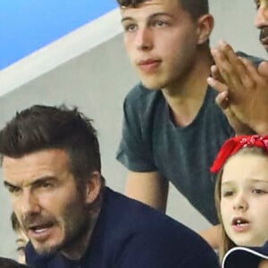 David Beckham avec sa fille Harper et sa mère Sandra Georgina West dans les tribunes lors du quart de finale de la Coupe du Monde Féminine de football opposant l'Angleterre à la Norvège au stade Océane au Havre, France, le 27 juin 2019. L'Angleterre a gagné 3-0. © Gwendoline Le Goff/Panoramic/Bestimage