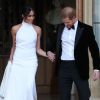 Le prince Harry, duc de Sussex, et Meghan Markle, duchesse de Sussex, habillée d'une robe Stella McCartney et portant une bague sertie d'une aigue-marine ayant appartenu à Lady Diana, ont quitté le château de Windsor après la réception offerte par Elizabeth II pour rejoindre à bord d'une Jaguar E-Type Concept Zero immatriculée "190518" Frogmore House où avait lieu la réception de leur mariage, le 19 mai 2018.