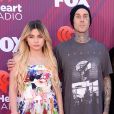 Travis Barkeret ses enfants au photocall des "2019 iHeart Radio Music Awards" au Microsoft Theatre à Los Angeles, le 14 mars 2019.