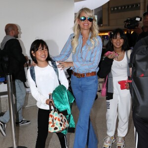 Semi-exclusif - Laeticia Hallyday et ses filles Jade et Joy arrivent à l'aéroport de LAX à Los Angeles pour prendre un vol pour la France le 13 juin 2019. Laeticia a enregistré ses baggages au comptoir d'Air France avant de retirer de l'argent à un distributeur automatique de billets pour donner un pourboire au porteur de ses valises. Laeticia Hallyday sera présente le samedi 15 juin à Toulouse pour l'inauguration de l'esplanade qui portera le nom de Johnny Hallyday, devant la salle de concert du Zénith. Elle passera par la suite une dizaine de jours en France avant de repartir pour Saint-Barthélemy.