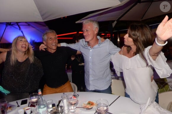 Didier Deschamps fête sa victoire avec sa femme Claude, Nagui et sa femme Mélanie Page et des amis à la Gioia et au VIP Room à Saint-Tropez, le 21 juillet 2018. © Rachid Bellak/Bestimage