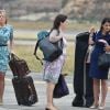 Natasha Archer, la styliste de la duchesse, Rebecca Deacon, secrétaire particulière de la duchesse et Sophie Agnew, assistante de la secrétaire particulière de la duchesse - Le personnel du prince William et de Kate Middleton à son arrivée à l'aéroport de Paro au Bhoutan 14 avril 2016.