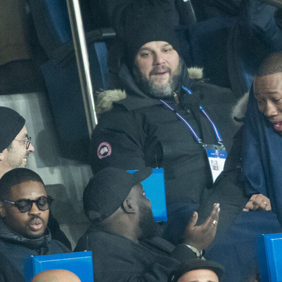 Issa Doumbia et Mokobé assistent au match Paris Saint-Germain - Lille pour la 14e journée du championnat de Ligue 1 Conforama, au Parc des Princes. Paris, le 22 novembre 2019.