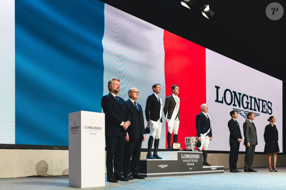 Simon Delestre, Kevin Staut et Roger Yves Bost sur le podium du Longines Grand Prix de Paris. Villepinte. Le 8 décembre 2019.