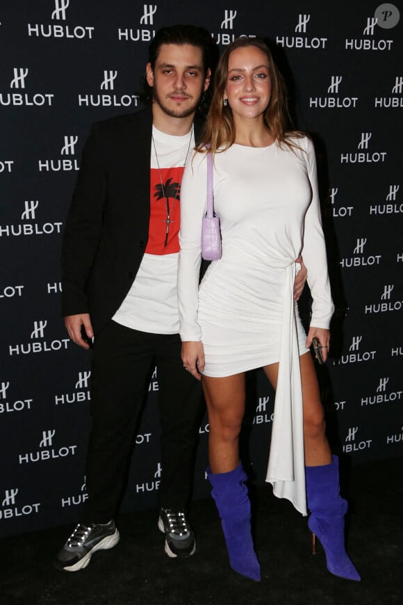 Adrien Erka et Carla Ginola assistent à la soirée "Hublot Loves Art" organisée par Hublot, à la Fondation Louis Vuitton. Paris, le 16 décembre 2019.