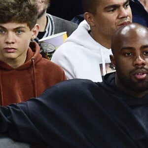 Teddy Riner et sa compagne Luthna Plocus assistent au NBA Game Paris 2020 opposant les Milwaukee Bucks et les Charlotte Hornets à l'AccorHotels Arena. Paris, le 24 janvier 2020. © JB Autissier / Panoramic / Bestimage