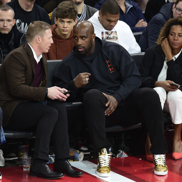 Teddy Riner et sa compagne Luthna Plocus assistent au NBA Game Paris 2020 opposant les Milwaukee Bucks et les Charlotte Hornets à l'AccorHotels Arena. Paris, le 24 janvier 2020. © JB Autissier / Panoramic / Bestimage