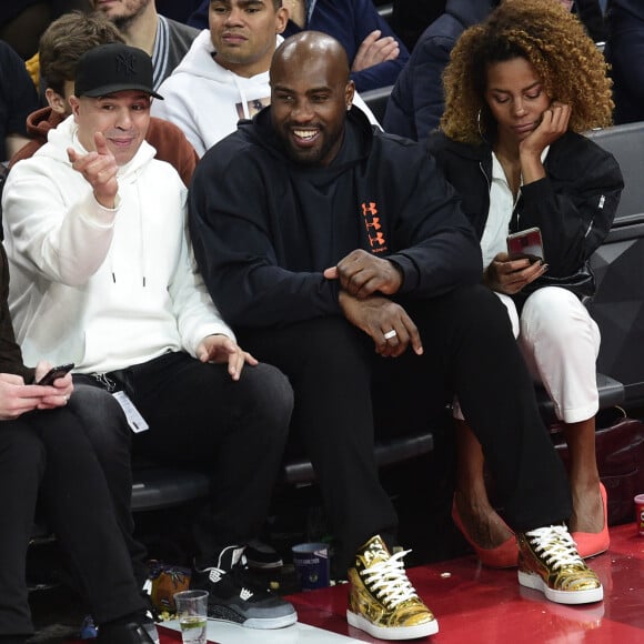 DJ Cut Killer, Teddy Riner et sa compagne Luthna Plocus assistent au NBA Game Paris 2020 opposant les Milwaukee Bucks et les Charlotte Hornets à l'AccorHotels Arena. Paris, le 24 janvier 2020. © JB Autissier / Panoramic / Bestimage