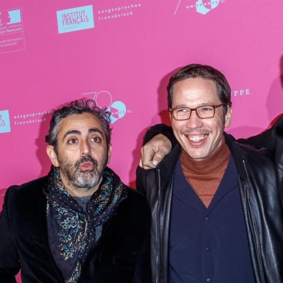 Eric Toledano, Reda Kateb, Vincent Cassel à la première de "Hors Normes" lors de la semaine du cinéma français de Berlin, le 28 novembre 2019.