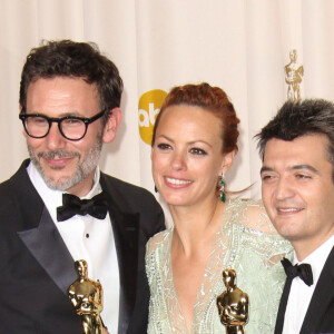 Michel Hazanavicius, Bérénice Bejo et Thomas Langmann aux Oscars en 2012 pour le film "The Artist". 


