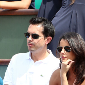 Maxime Chattam et Faustine Bollaert à Roland Garros, en mai 2012 à Paris.