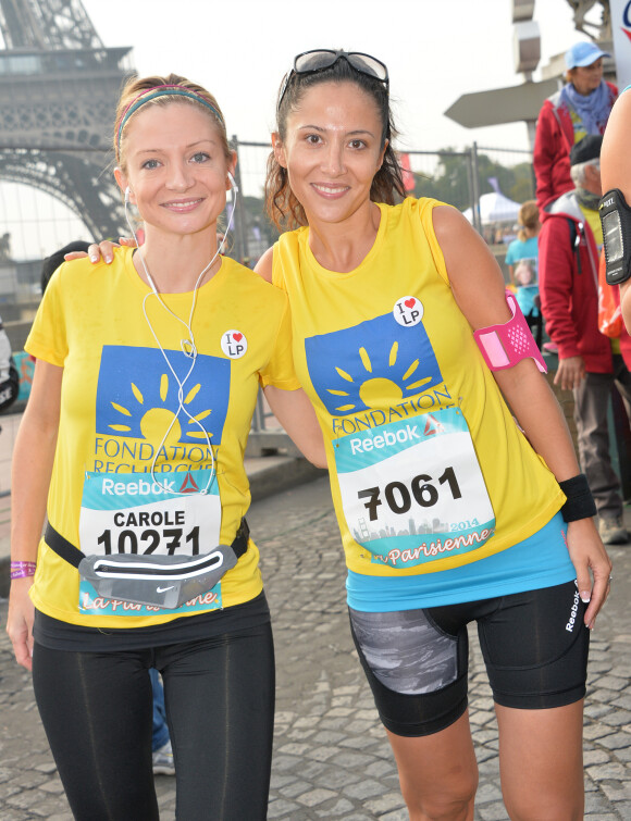 Fabienne Carat et sa soeur Carole - Course "La Parisienne 2014" pour la lutte contre le cancer, au Champs de Mars à Paris, le 14 septembre 2014.