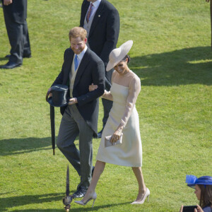 Le prince Harry, duc de Sussex et Meghan Markle, duchesse de Sussex lors de la garden party pour les 70 ans du prince Charles au palais de Buckingham à Londres le 22 mai 2018.