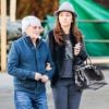 Exclusif - Bernie Ecclestone se promène avec sa femme Fabiana Flosi et des amis dans les rues de Gstaad pendant leurs vacances. Le 22 décembre 2014.