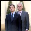 Nicolas Sarkozy et Antoine Rufenacht lors de la cérémonie en hommage au préfet Claude Erignac place Beavau, à Paris, pour les 10 ans de sa mort.