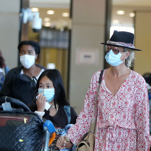 Exclusif - No Web - Prix Spécial - Laeticia Hallyday en famille au départ de l'aéroport Charles-de-Gaulle à Paris pour Saint-Barthélemy. Elle quitte Paris avec sa fille Joy, la nounou Maryline et sa grand-mère Mamie Rock (pas sur les photos) pour ses vacances à Saint-Barth. Sa deuxième fille Jade la rejoindra dans une semaine, accompagnée de sa marraine M.Poniatowski. Le 21 juillet 2020 Pour infos, voir vendeur  