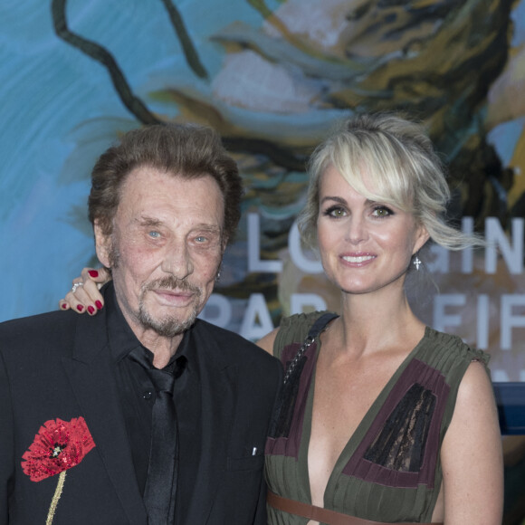 Exclusif - Johnny Hallyday et sa femme Laeticia Hallyday - Soirée au profit de l'Association "La Bonne étoile" de Laeticia Hallyday lors du 3ème Longines Paris Eiffel Jumping à la plaine de Jeux de Bagatelle à Paris le 1er juillet 2016 dans le Pavillon Eiffel du Longines Paris Eiffel Jumping décoré par Luxury Living. © Olivier Borde / Veeren / Bestimage