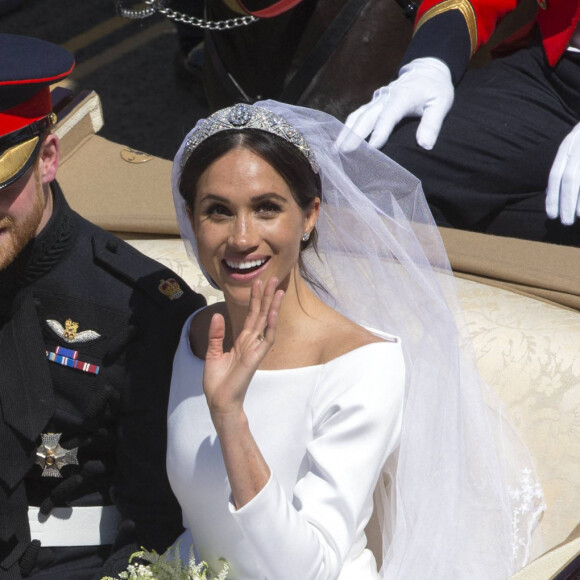 Le prince Harry, duc de Sussex, et Meghan Markle, duchesse de Sussex, en calèche au château de Windsor après la cérémonie de leur mariage au château de Windsor, Royaume Uni, le 19 mai 2018.