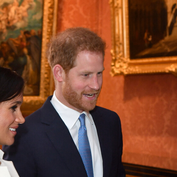 Le prince Harry, duc de Sussex, et Meghan Markle (enceinte), duchesse de Sussex - La famille royale d'Angleterre lors de la réception pour les 50 ans de l'investiture du prince de Galles au palais Buckingham à Londres. Le 5 mars 2019