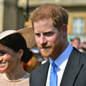 Le prince Harry, duc de Sussex, et Meghan Markle, duchesse de Sussex, lors de la garden party pour les 70 ans du prince Charles au palais de Buckingham à Londres. Le 22 mai 2018